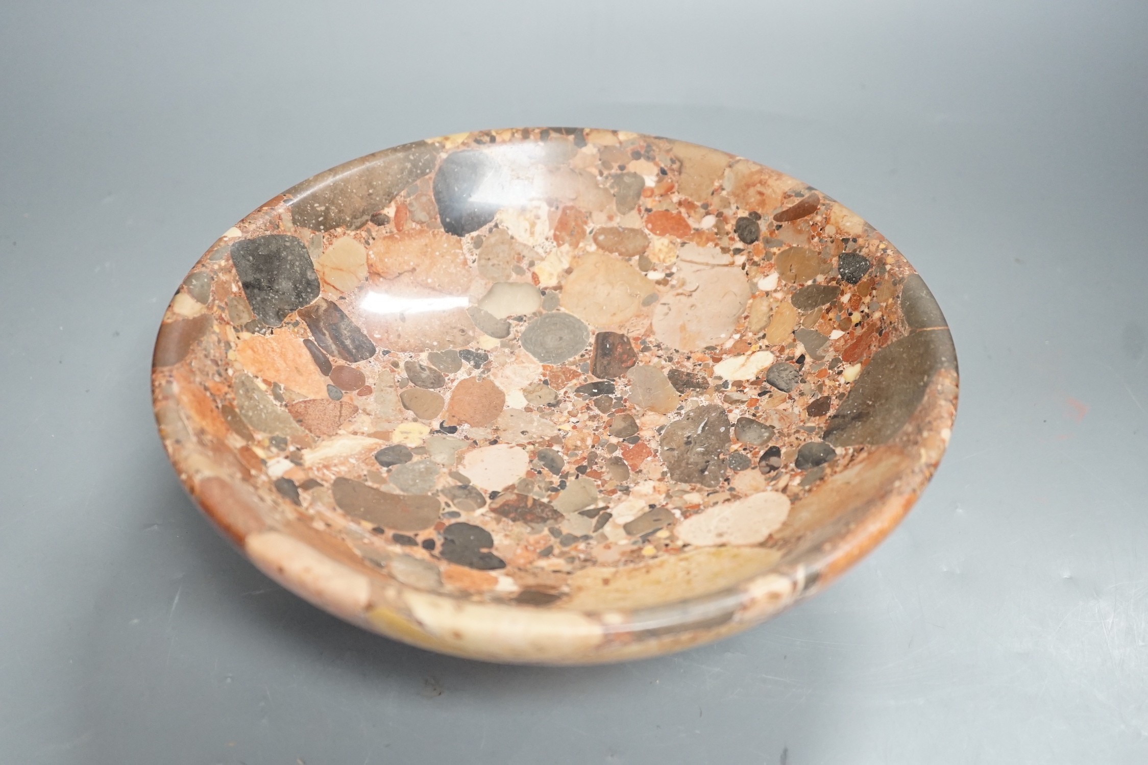 A small polished puddingstone tazza, 23cms diameter